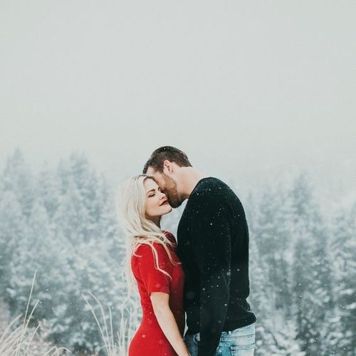 beautiful couple in love hugging in winter