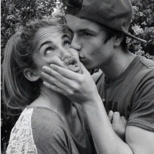 man kisses a girl